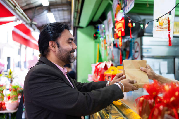 istock Mature Sikh business man doing bakery window shopping at a local bakery store 1984243898