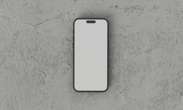 istock Smartphone with a blank screen on a white background. Smartphone mockup closeup isolated on white background concrete 1984307217