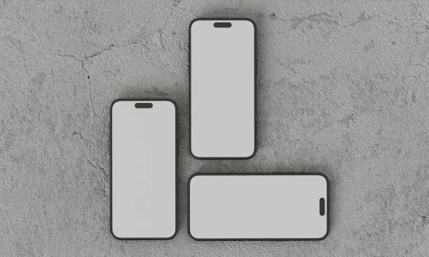 istock Smartphone with a blank screen on a white background. Smartphone mockup closeup isolated on white background concrete 1984307235