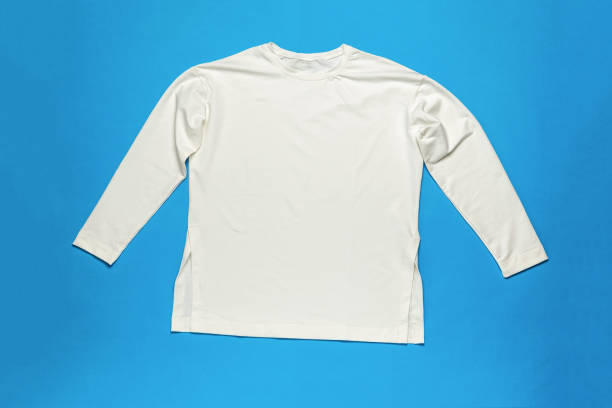 istock White long sleeve T-shirt on a blue background. 1984316493