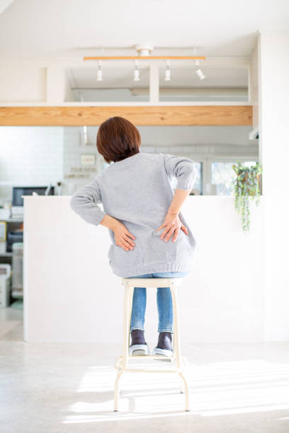 istock A middle-aged Japanese woman suffering from back pain 1984343247