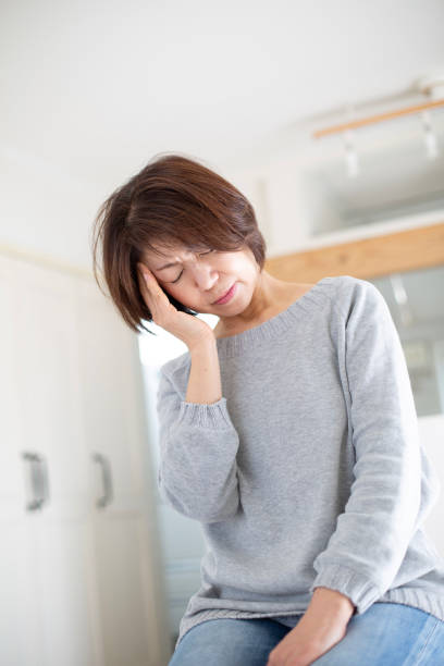 istock Japanese housewife suffering from migraine 1984343775