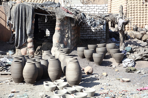 pottery, rubish, buildings in a village