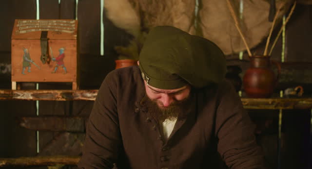 Upset bearded keeper in bonnet in tavern