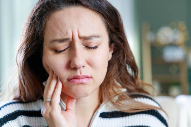 istock Young woman with toothache 1984439991