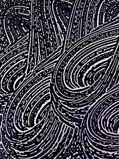 Pattern of white foam on a black background, vertical