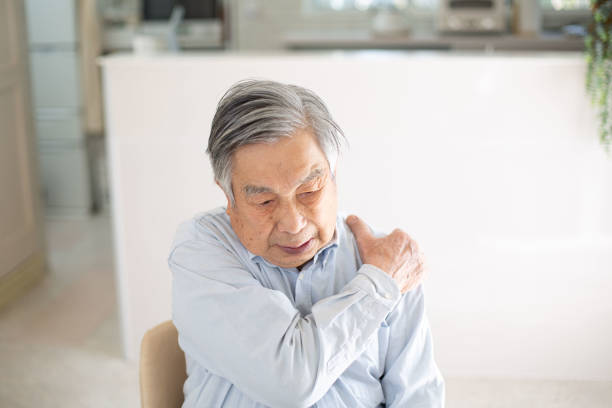 istock Japanese senior man suffering from shoulder pain​ 1984461519