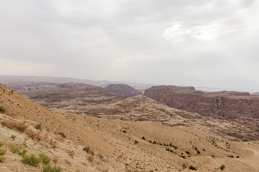 View  from distance from high hill to the famous gorge in which it is located thr Nabatean Kingdom of Petra in the Wadi Musa city in Jordan