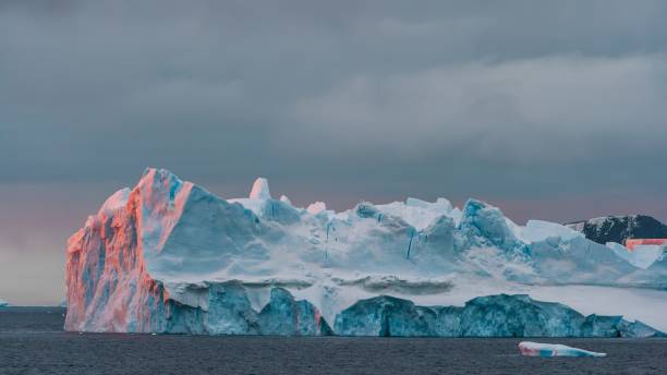Antarctica Sunrise Illuminated Iceberg from Dawn Sunlight