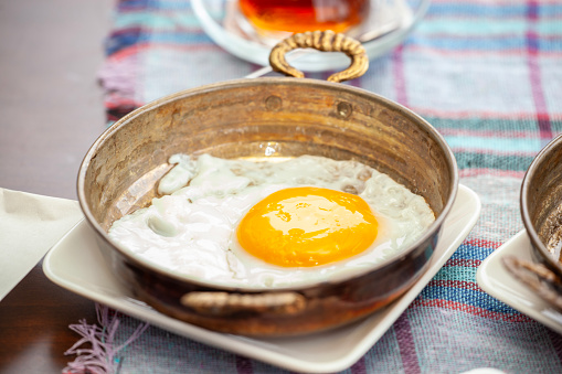 Fried Egg on Spread Turkish Breakfast Table.