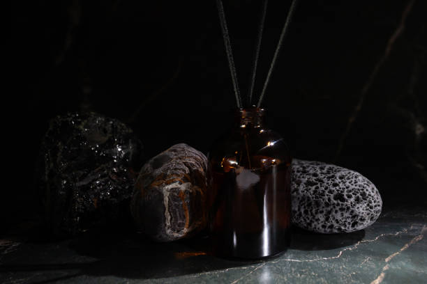 Aroma diffuser with natural stones, cozy spa setting, fragrance therapy, peaceful ambiance