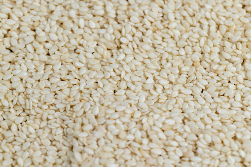 white sesame seeds on the kitchen table, used in cooking sesame seeds