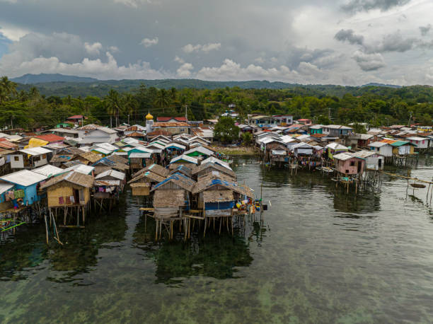 Stilt Houses over the sea in Zamboanga. Philippines. Wooden houses on stilts in Zamboanga. Mindanao, Philippines. Drone view. zamboanga del sur stock pictures, royalty-free photos & images