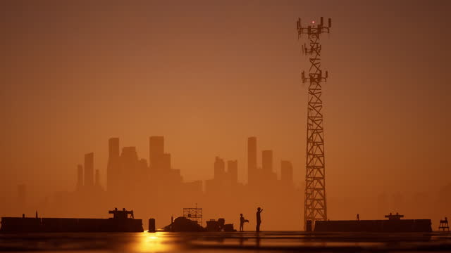 Installation 5G signal towers sunset
