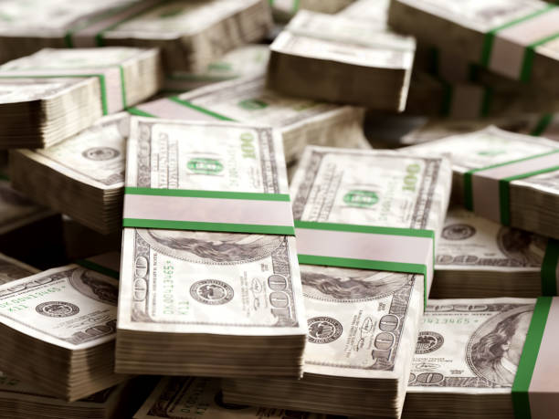 istock Pile of 100 dollar bill wads 1984547382