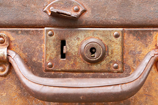 rusty lock and handle of old suitcase