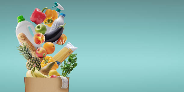 istock Assorted groceries falling in a paper bag 1984565876