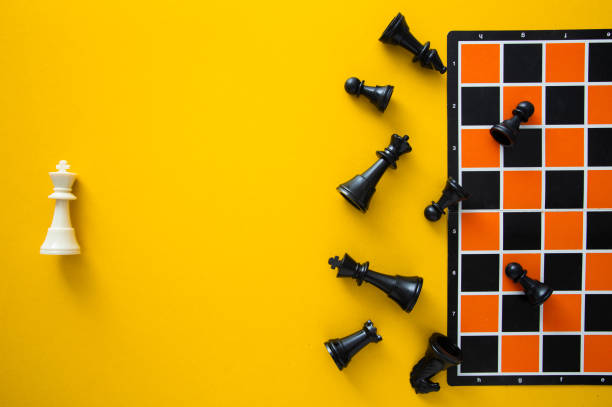 istock Top view chessboard on yellow background - Winner and Loser 1984568547