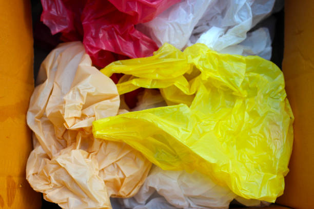 istock Used plastic bags in cardboard boxe 1984594418