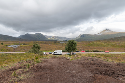 Cars parked by the Black Mount Area(Am Monadh Bubh) in Glencoe, Highlands, Scotland
