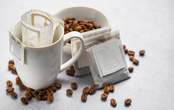 istock Drip coffee bag with ground coffee in  cup 1984633479