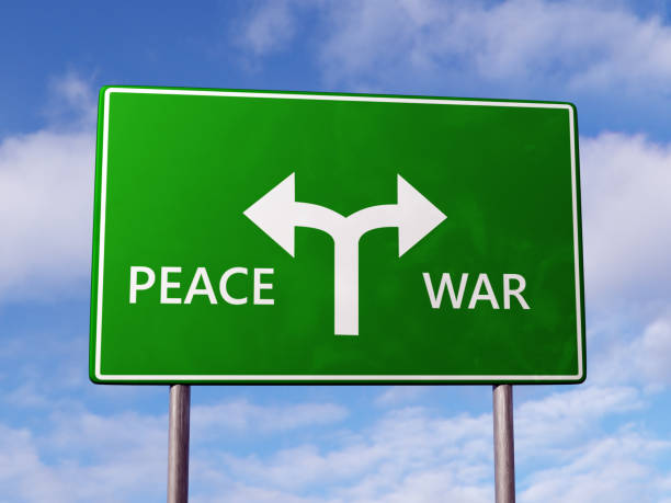 istock Two directional roadsign with Peace and War destination indications 1984654106
