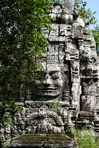 Stone face carved on Ta Som temple's Gopura (entrance way). Ta Som is a small temple at Angkor, Cambodia, built at the end of the 12th century for King Jayavarman VII.