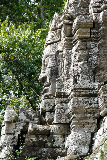Stone face carved on Ta Som temple's Gopura (entrance way). Ta Som is a small temple at Angkor, Cambodia, built at the end of the 12th century for King Jayavarman VII.