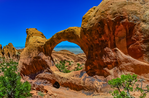 The sunrise at the Mesa Arch in the Canyonlands National Park makes the arch glow, Utah, USA.