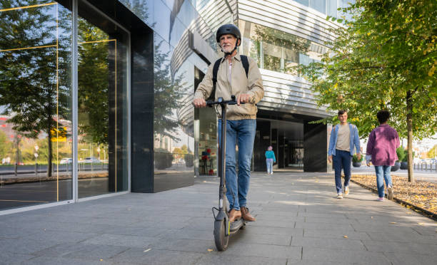 istock Well-dressed Senior Man Riding Electric Scooter 1984713247