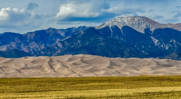 istock Great Sand Dunes with mountains in the background, Colorado, US 1984753286