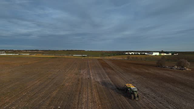 general aerial view of a tractor during planting work in the field