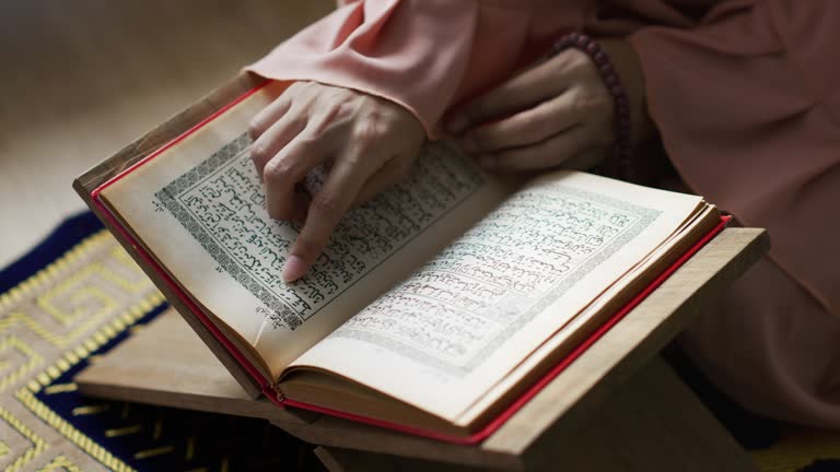 Reading Quran book in ramadan