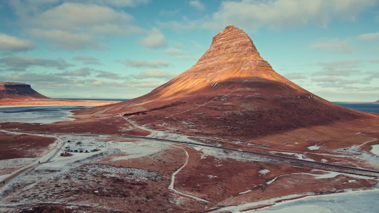 Beautiful aerial view of sunny kirkjufellsfoss waterfall and Kirkjufell mountain, Iceland