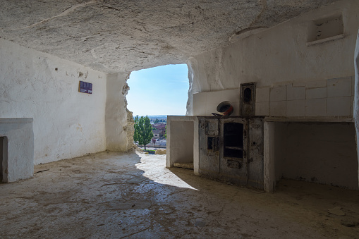 Interior of Arguedas caves with kitchen and white walls, Navarra, Spain