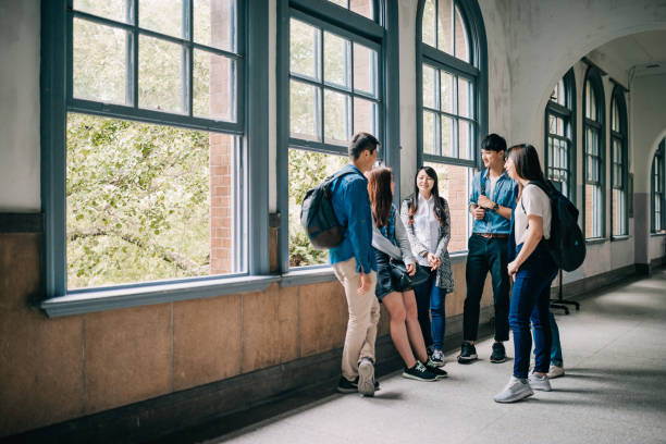istock Asian students in university building after classes, talking and smiling 1984870017