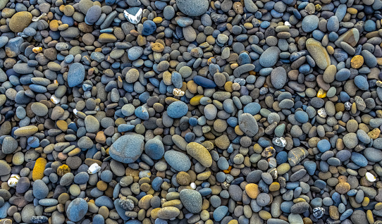 Multicolored round pebble stones on the Pacific Ocean in Olympic National Park, Washington, USA