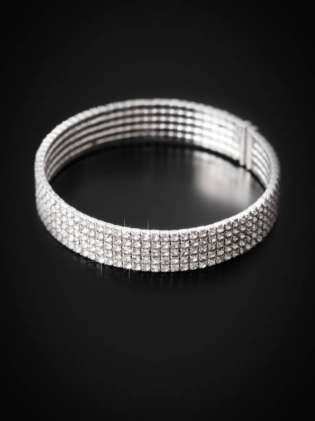 istock Silver bracelet isolated on black background 1984871647