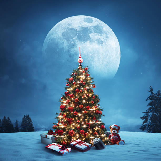 istock Wintry landscape, decorated Christmas tree and gifts 1984880727