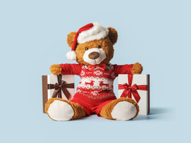 istock Cute teddy bear and Christmas gifts 1984883364