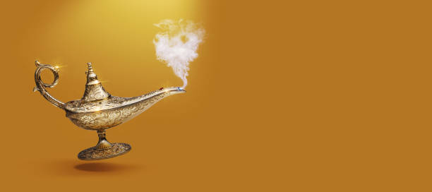 istock Golden magic lamp on gold background 1984893494