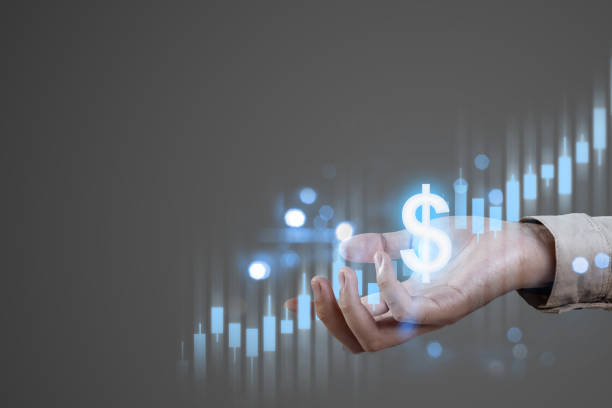 istock A businessman shows a virtual dollar sign and stock chart 1984903136