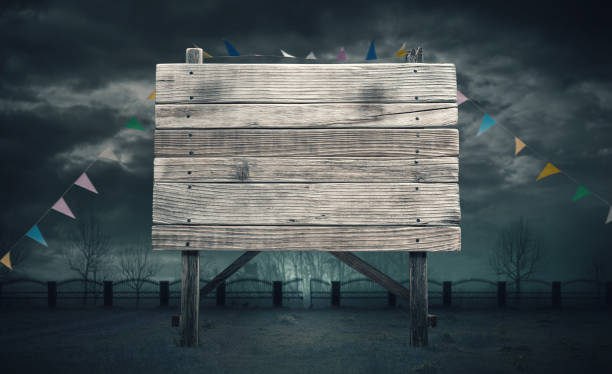 istock Old wooden sign and dark cloudy sky 1984903976