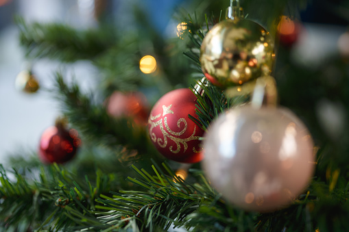 Decorational Ornaments on a fake plastic tree.