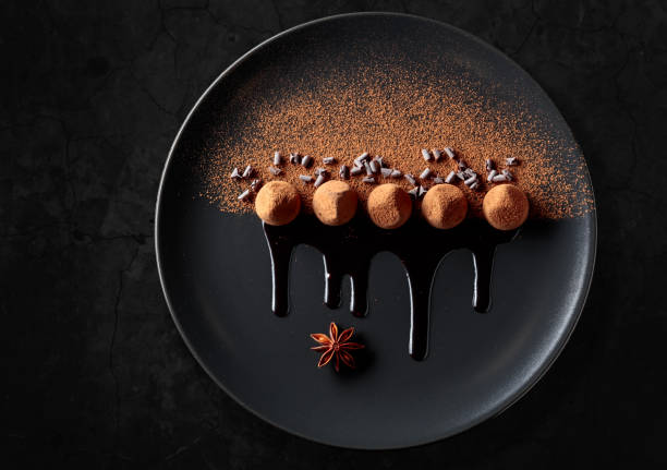 istock Chocolate truffles on a black plate. 1984915809