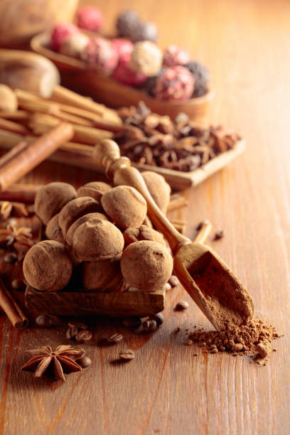 istock Chocolate truffles on a wooden table. 1984915823