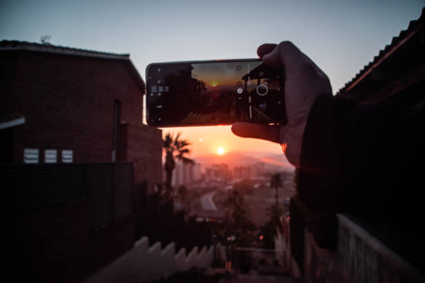 istock sunset from the phone 1984948663