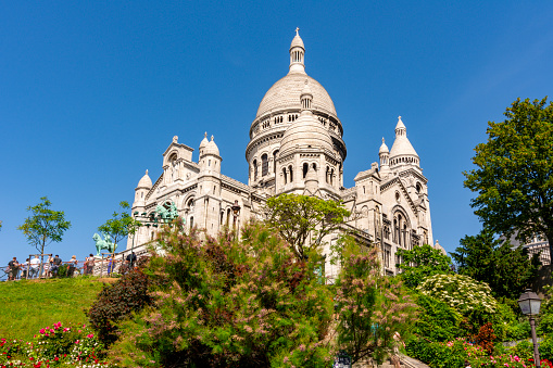 Paris, France - May 2019: Basilica of Sacre Coeur (Sacred Heart) on Montmartre hill