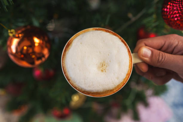 Cappuccino with christmas tree decoration background