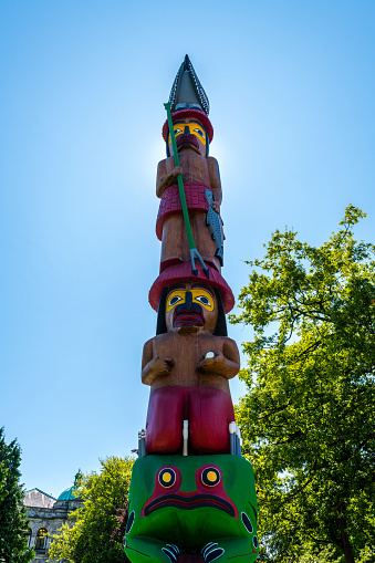Three (3) totem poles in Ketchikan, Alaska.